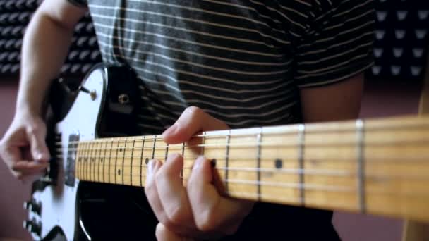Musician plays on electro guitar in the Studio. - Felvétel, videó