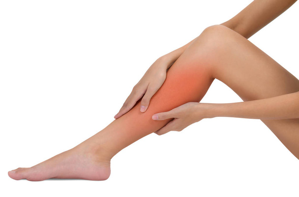 woman holding her beautiful healthy long leg with massaging shin and calf in pain area with red highlighted, Isolated on white background. - Photo, Image