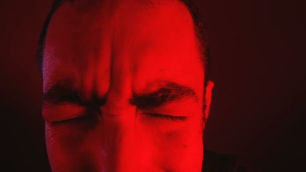 Closeup of man open his closed eyes and looking up and into camera - Footage, Video