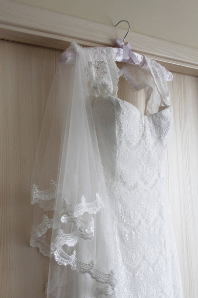 wedding dress hanging on the door - Photo, Image