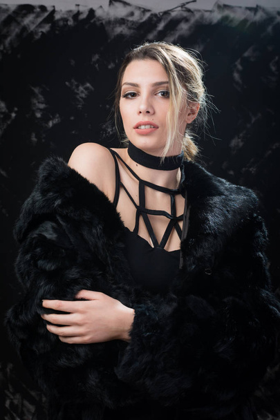 Gorgeous elegant young woman in black outfit posing - Zdjęcie, obraz