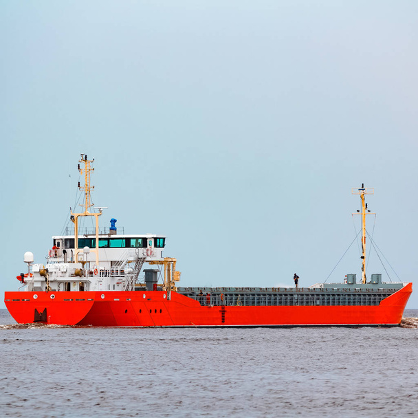 Orange cargo ship. Logistics and merchandise transportations - Photo, Image