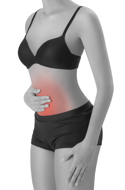 woman posing perfect healthy body shape and holding her belly in pain area, black and white color with red highlighted, Isolated on white background. - Foto, afbeelding