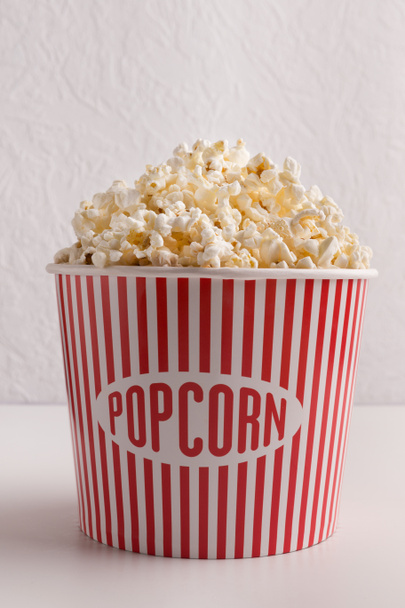 Bucket of popcorn on white background - Photo, Image