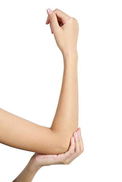 Woman holding her elbow in pain, isolate on white background. - Foto, afbeelding