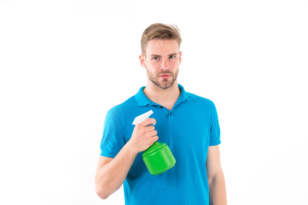 Macho hold plastic spray bottle isolated on white background. Man with water sprayer in hand. Gardening and cleaning tool. Housework or household and sanitary concept. - Φωτογραφία, εικόνα