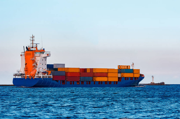 Blue container ship. Global logistics and merchandise transfer - Photo, Image