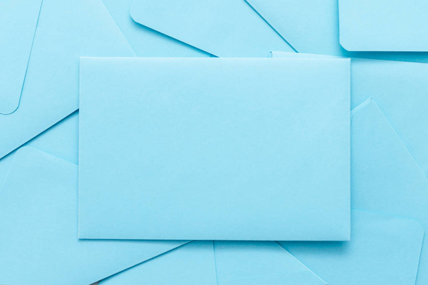 scattered blue mail envelopes background. - Photo, image