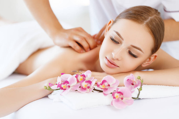 a beautiful girl enjoys massage and spa treatment - Φωτογραφία, εικόνα