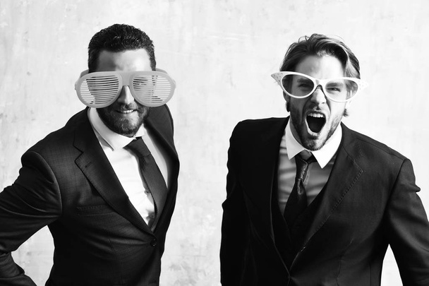 Office life concept. handsome bearded businessmen with funny glasses - Foto, afbeelding