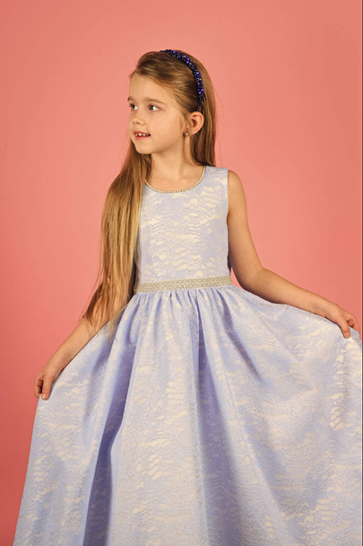 little girl model, wedding, fashion concept - girl dressed in blue and blue dress smiling. - Фото, изображение