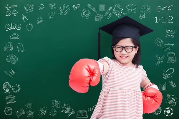 cute girl wearing  bachelor cap and gloves on green chalkboard - Photo, image