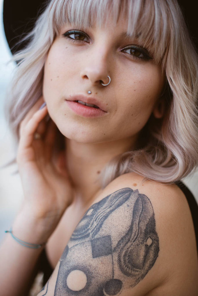 Beautiful young woman with tattoo  - Zdjęcie, obraz