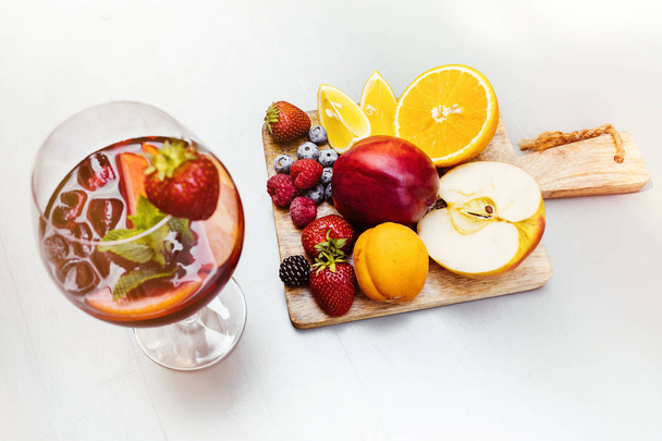 summer drink, fruit cocktail on white wood table with berries - Valokuva, kuva
