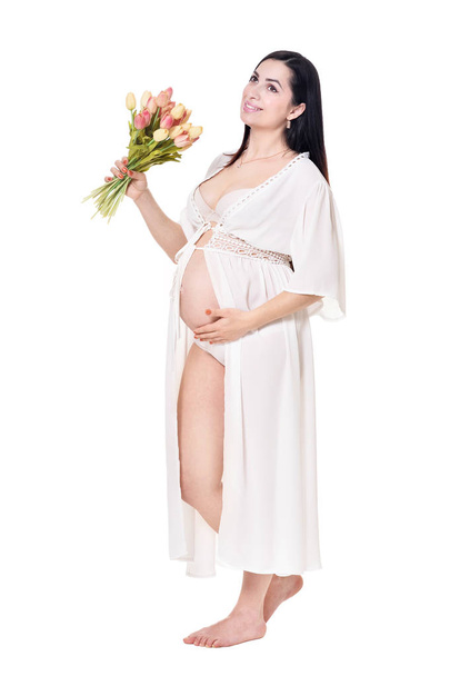 Beautiful pregnant woman with flowers  isolated on white background - Zdjęcie, obraz