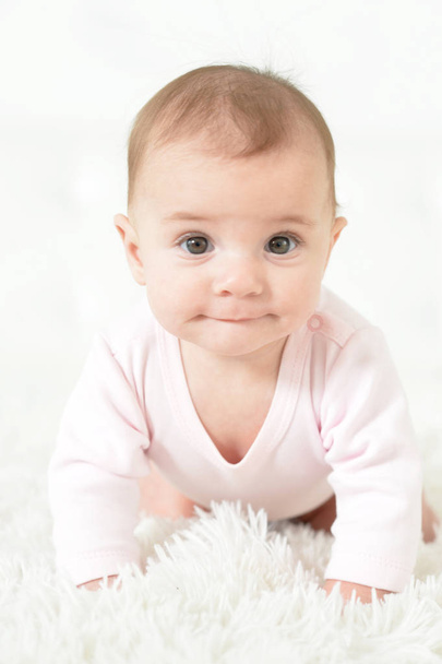Cute  baby girl  on white  blanket  - Foto, imagen