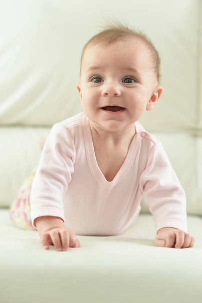Cute  adorable baby girl  on light  sofa - Fotografie, Obrázek