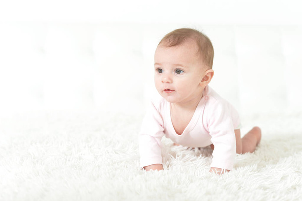 Cute  baby girl  on white  blanket  - Fotoğraf, Görsel