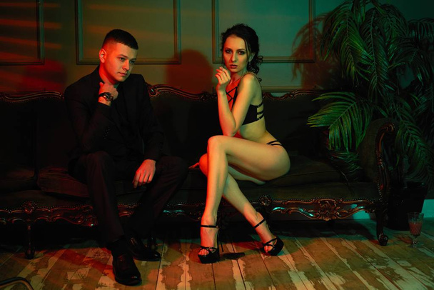 Young gorgeous fashion couple posing - 写真・画像