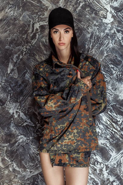 beautiful model in military jacket posing - Фото, изображение