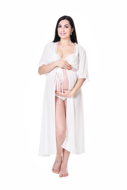 Young pregnant woman posing isolated on white background - Zdjęcie, obraz