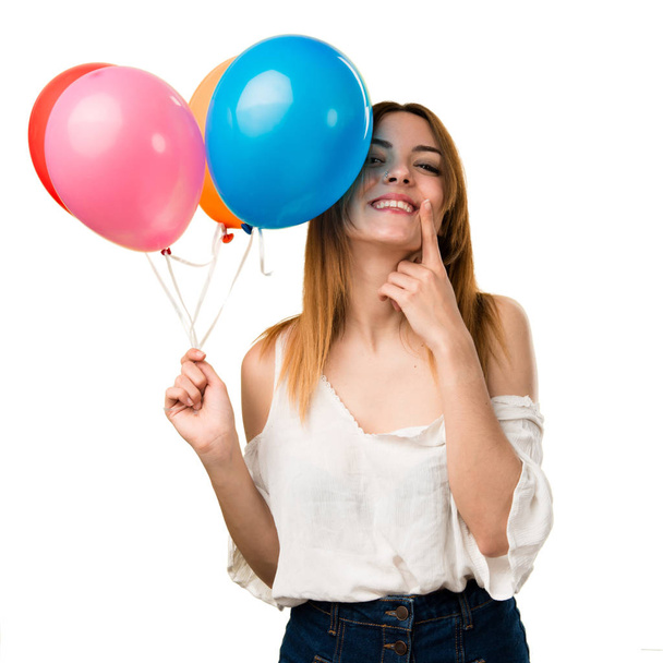 Menina bonita feliz segurando um balão
 - Foto, Imagem