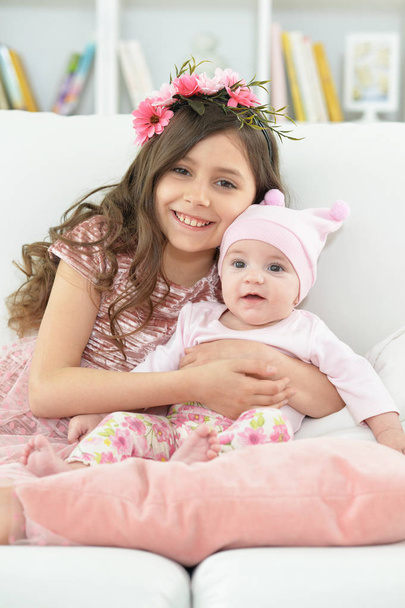 two beautiful cute sisters at home  - Foto, imagen