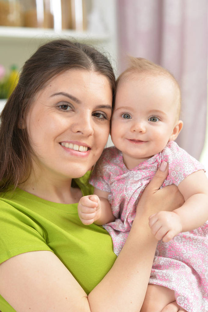 young woman with  baby girl at home - Foto, Imagem