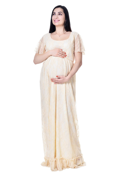 Young pregnant woman posing isolated on white background - Foto, imagen