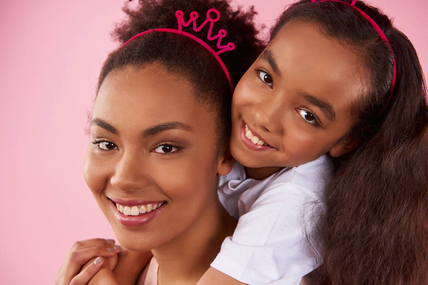 Afro American daughter and mother in sham crowns - Photo, Image