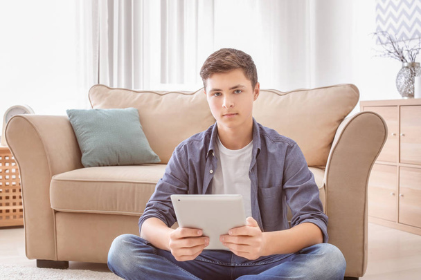 Stylish teenager using tablet  - Fotó, kép