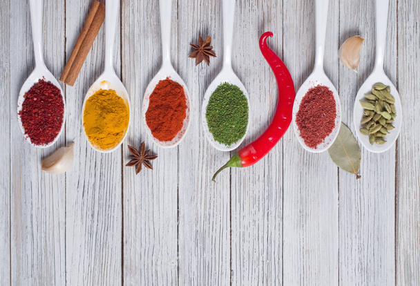 Various spices selection on a wooden background - Photo, Image