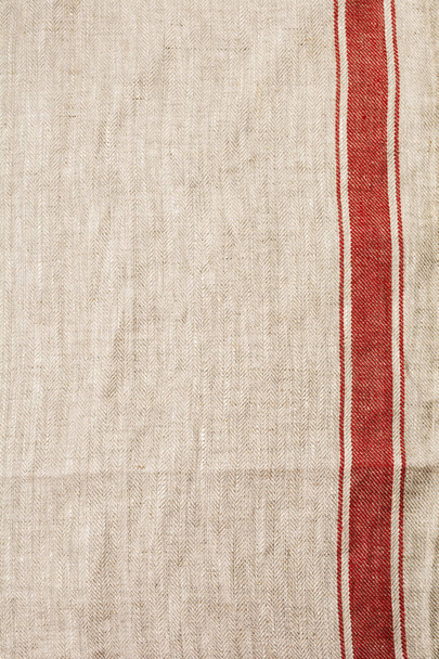 Texture of gray fabric with red stripe. Top view with copy space. - Zdjęcie, obraz
