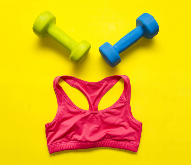 red, sports, top, dumbbell, yellow, background, top view, clothing, sports, still life, fitness,  flat lay - Photo, image