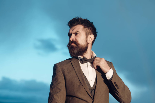 Hipster, bearded man on cloudy sky. Wanderlust, vacation and travel. - Photo, image
