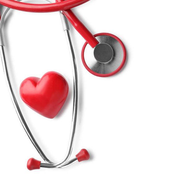 Stethoscope with red heart on white background. Health care concept - Valokuva, kuva