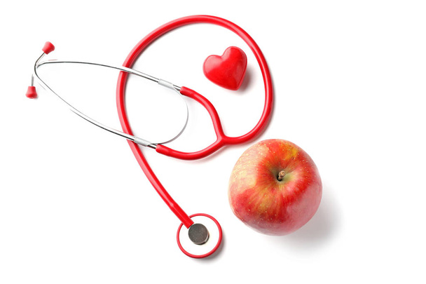 Stethoscope with apple on white background. Health care concept - Foto, Imagem