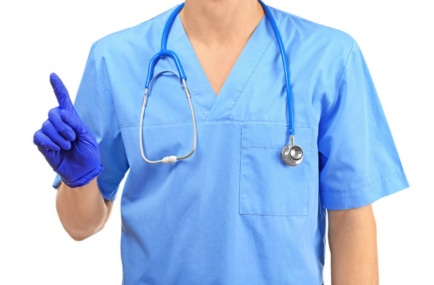 Male doctor showing something on white background - Фото, изображение
