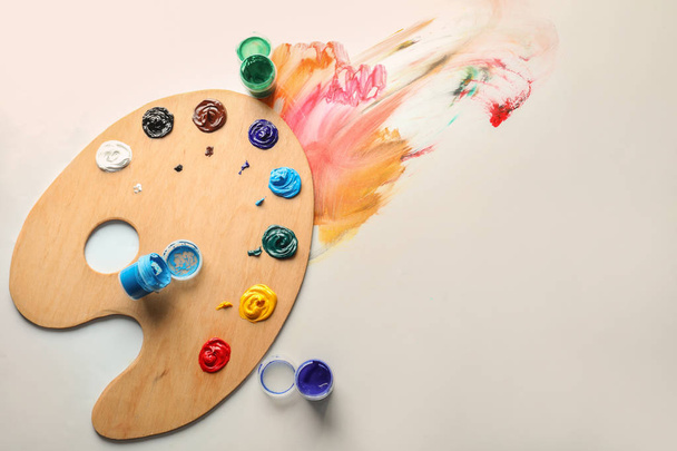 Wooden palette with paints on white background - Photo, Image