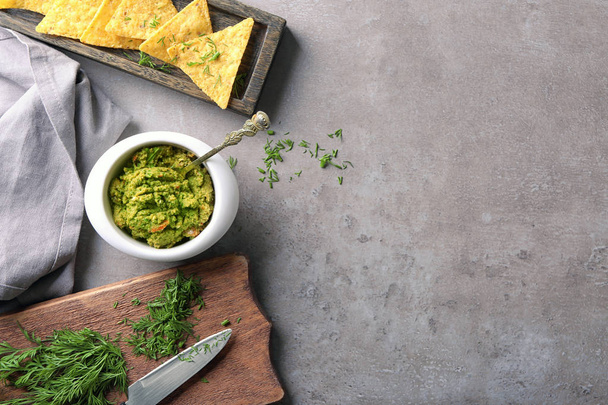 Composition with tasty guacamole on table - 写真・画像