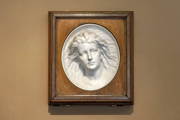 ondon, UK - April 2018: Marble relief titled The Artists Daughter by the Westmacott family exhibited at the Dorothy and Michael Hintze Galleries in Victoria and Albert Museum - Photo, Image