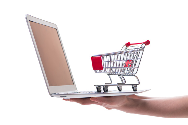 Online winkelen concept met laptop en trolley - Foto, afbeelding