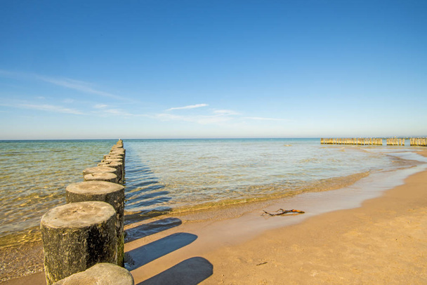 groins in the Baltic Sea with blue sky - Photo, Image