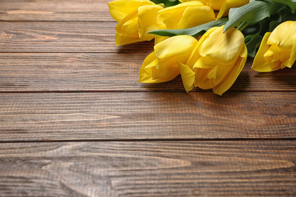 Beautiful tulips on wooden background - Fotografie, Obrázek