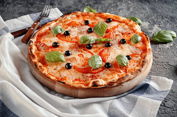 Tasty pizza on grey textured background - Photo, Image