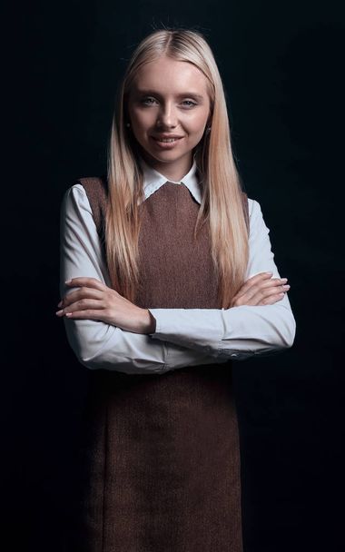 portrait of a confident young business woman. isolated on a dark background. - Φωτογραφία, εικόνα