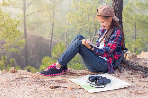 Female hiker write notes Nature trails, mountains, forests. Writer - Foto, Imagen