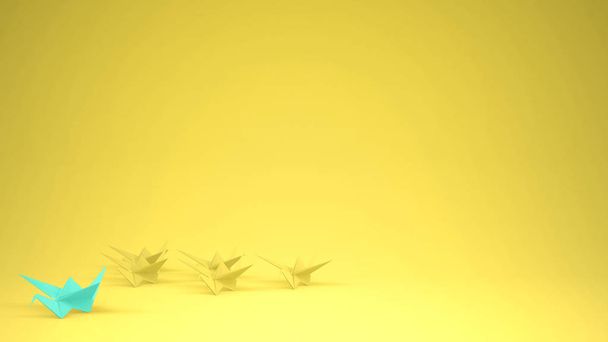 Origami turquoise paper crane leading group of cranes, leadership motivation concept idea with copy space, yellow background - Photo, Image