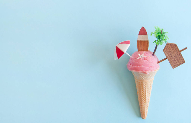 Strawberry icecream with beach items below sun  - Фото, изображение