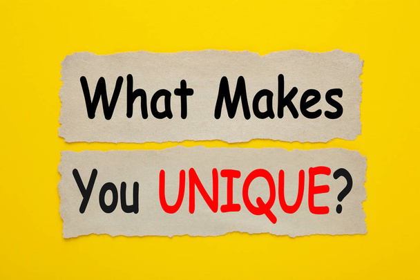 What Makes You UNIQUE written on old torn paper on yellow background. - Foto, immagini